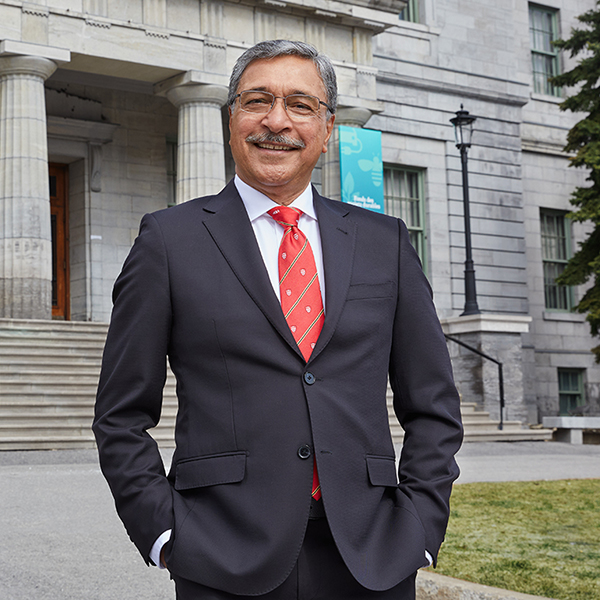 President Deep Saini in front of McCall MacBain Arts building