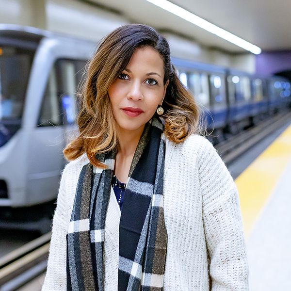Debra Thompson standing in front of a metro