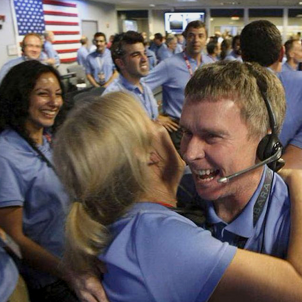 Peter Ilott hugs a colleague as they celebrate the science rover Curiosity's successful landing on Mars in 2012 (Photo: Brian Van Der Brug/Reuters).