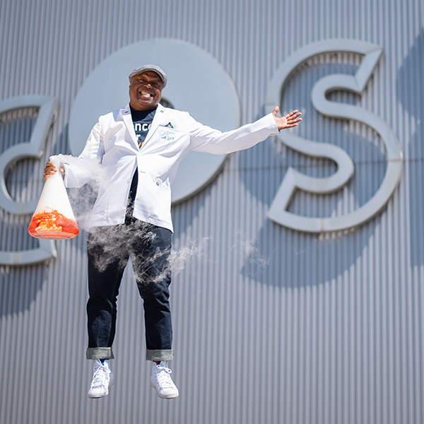 Frederick Bertley jumping with vaporous Erlenmeyer flask