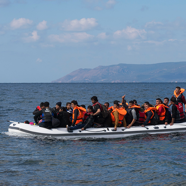 Boat full of immigrants crossing the sea