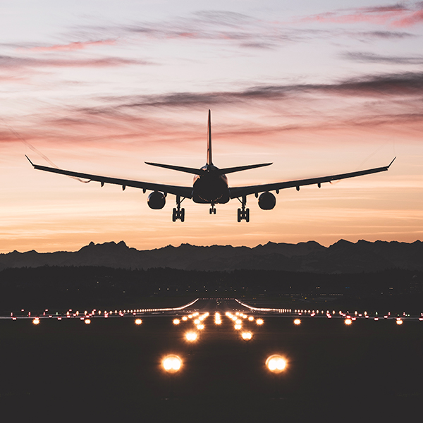 Airplane landing at dusk