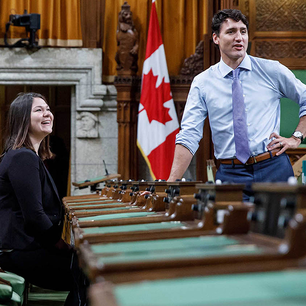 Breanne Lavallée-Heckert and Prime Minister Trudeau laughing together in the House of Commons