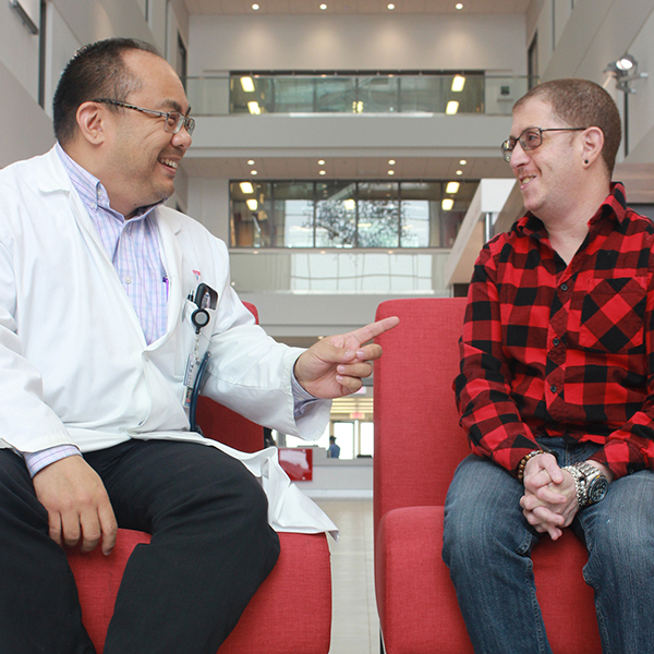 Donald Vihn seated, speaking with Steven Francis