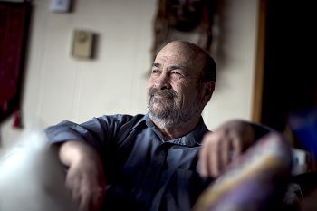 Jim Torczyner sitting in a chair