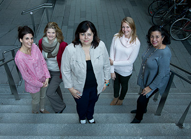 Melissa Maione, Liana Hall Dumond, Kathleen Massey, Marylou Cormier, and Jocelyn Younan standing on stairs looking up