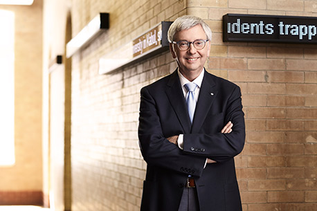 Stephen Toope smiling with his arms crossed