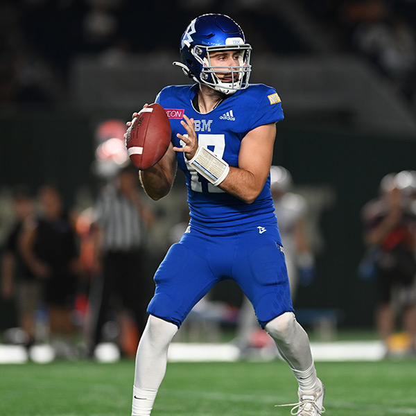 A football player holding a football