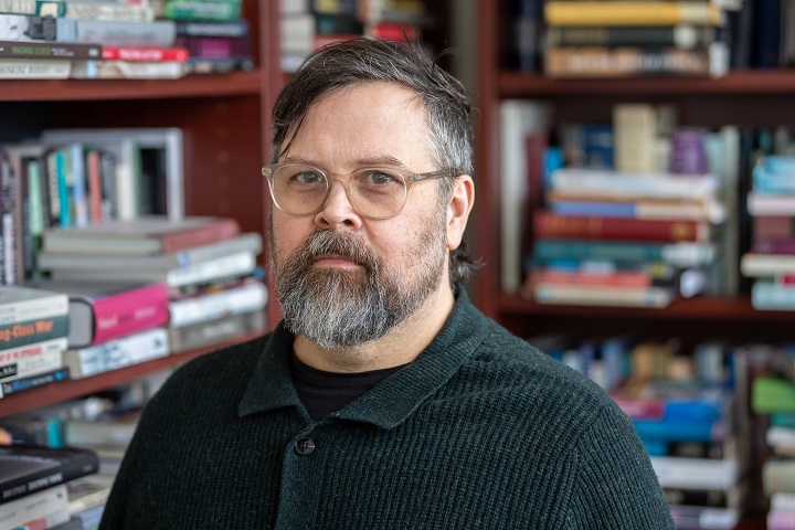 A person with a beard and glasses.