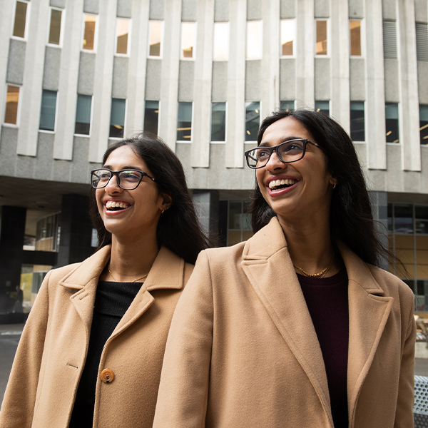 A couple of women smiling